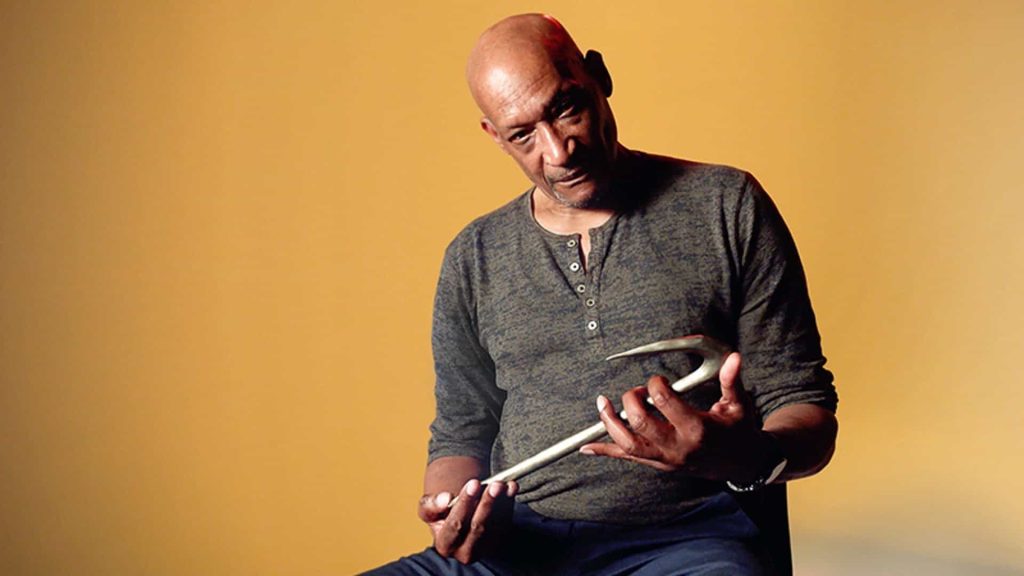 Tony Todd with his hook from Candyman